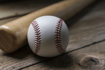 Baseball And Baseball Bat On Wooden Table Background, Close Up